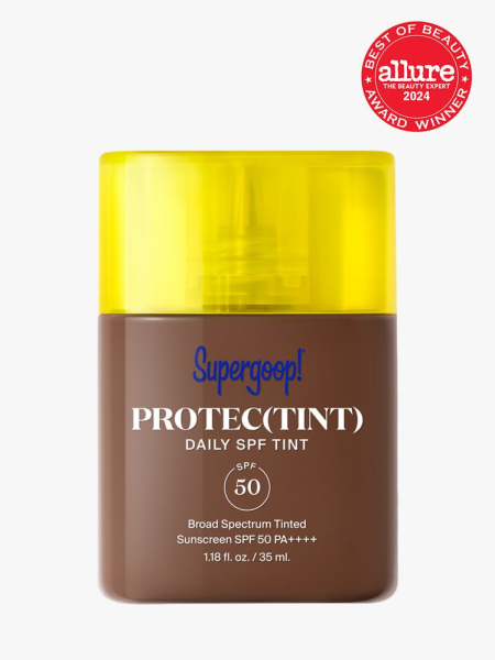 sunscreen in branded clear bottle with yellow cap on light gray background with red and white 2024 allure best of beauty seal