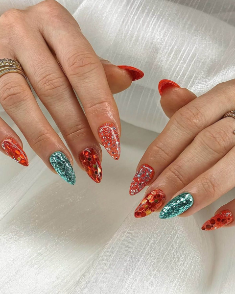 taylor swift tloas nails orange and blue glitter