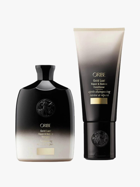 Oribe Gold Lust Duo two black to white gradient bottles of shampoo and condtioner on light gray background
